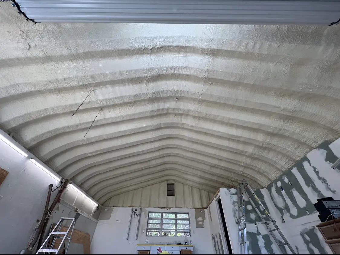 Spray polyurethane foam applied to the underside of a metal roof deck in Livingston